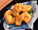 A picture of step 40 of Chessy-Chicken filled bowtie buns.