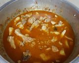 A picture of step 12 of Aalu chicken ka salan.