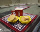 A picture of step 3 of Ginger Tea with biscuit's.