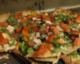 A picture of step 4 of Chicken satay kebabs and home made pili pili cheesy chapati nachos in the jiko oven :).