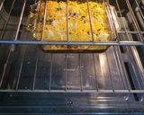 A picture of step 10 of Bourbon barbecue chicken lasagna roll ups.