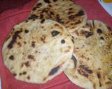 A picture of step 2 of Naan bread nd potatoe with baked beans sauce.