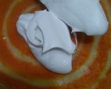 A picture of step 11 of Orange Marble Swiss Roll.