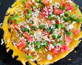 A picture of step 3 of Besan chilla with stuffing.