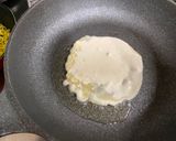 A picture of step 2 of Omu-Okonomiyaki (Japanese as-you-like pancake wrapped with egg).