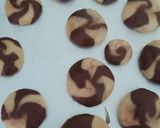A picture of step 7 of Two tone cookies with chocolate filled inside.