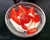 A picture of step 2 of My Healthy Dessert. Greek yogurt & Sliced fresh 🍓+ Nuts.