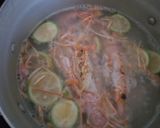 A picture of step 1 of Pad thai with king prawns and lemon slices and tagliatelle rice.