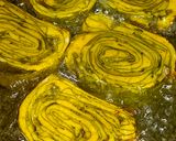 A picture of step 9 of Authentic Rickwach with Urad Dal and Colocasia leaves.