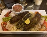 A picture of step 8 of Chullu kabab with butter saffron rice.