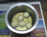 A picture of step 3 of Rasgolla with choco sauce.