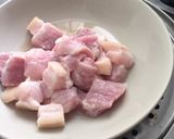 A picture of step 1 of Pork rice wine stew.