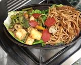 A picture of step 9 of Veg sizzler of sehezwan hakka noodles with sauteed vegetable.