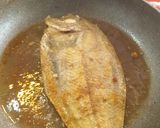 A picture of step 3 of Fried European Sole on a Bed of Potatoes and Garlic with Onion Rings.