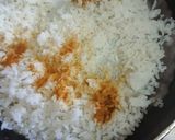 A picture of step 1 of Turmeric rice with raisins.