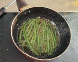 A picture of step 4 of Green beans in chilli garlic.