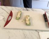 A picture of step 3 of Cucumber hummus boat.