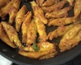 A picture of step 2 of Macha bhaja(fish fry).