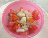 A picture of step 3 of Simple tomato cucumber salad.