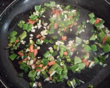 Foto del paso 4 de la receta: Paella mixta de arroz negro