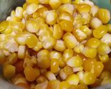 A picture of step 1 of Corn fritters in appe pan.