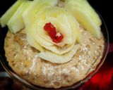 A picture of step 8 of Doodh daliya in pressure cooker (with different toppings).