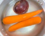 A picture of step 1 of Beet Carrot and Orange Detox Drink.