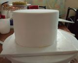 A picture of step 8 of Chocolate with ground nuts cake covered in fondant.