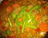 A picture of step 8 of Turmeric rice with minced meat and vegies.