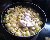 A picture of step 6 of Cheesy corn Macaroni.