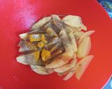 A picture of step 2 of Rosemary baked potato wedges.