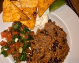 A picture of step 4 of 15 minute meat free loaded nachos.