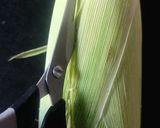A picture of step 1 of CHEESY BUTTERI CORN on COB.