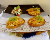 A picture of step 7 of Patacones or Tostones with minced chicken topping.