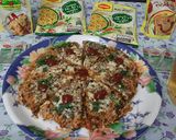 A picture of step 13 of Maggi Nutrilicious Masala VEG ATTA noodles Vegetables pizza.