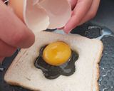 A picture of step 5 of Savoury Rosemary Flower Egg in a Hole.