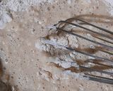 A picture of step 5 of Eggless Marble Muffins.