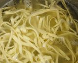 A picture of step 9 of Homemade egg pasta with shredded chicken sauce.