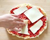 A picture of step 3 of Bread Pizza.