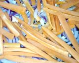 A picture of step 5 of Shallow fried sausage strips.