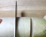 A picture of step 2 of Kouhaku Namasu (Daikon and carrot pickles).