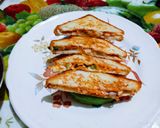 A picture of step 3 of Amul cheese spread vegetable sandwich.