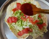 A picture of step 3 of Masala papad or salad on papad.