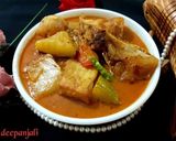 A picture of step 12 of Katla fish with baby pumpkin/ kochi kumdo diye katla machher jhol.