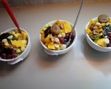 A picture of step 5 of #endyearchallenge mixed fruit salaad different nuts.