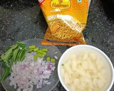 A picture of step 1 of Kanda, Batata Poha with Aloo Bhujia Sev.