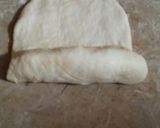 A picture of step 4 of Achari pizza roll.
