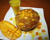 A picture of step 10 of Mango pancake with mango sauce.