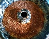 A picture of step 4 of Kake stuffed with chocolate cookie powder, cinnamon, almonds.