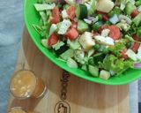 A picture of step 5 of Mix Veggies salad 🥗 with orange 🍊 dressing.